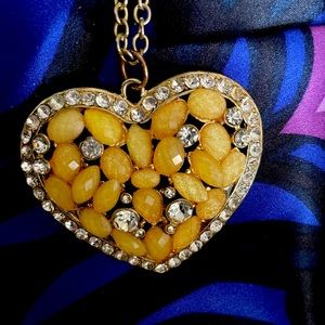 Heart shaped pendant with clear rhinestones & yellowish beads on a 16” chain